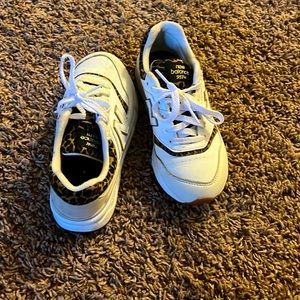 New balance shoes. Good for little kids, and for your kids.